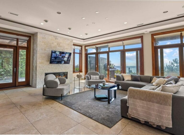Living room with water views in a home operated by Luvilla